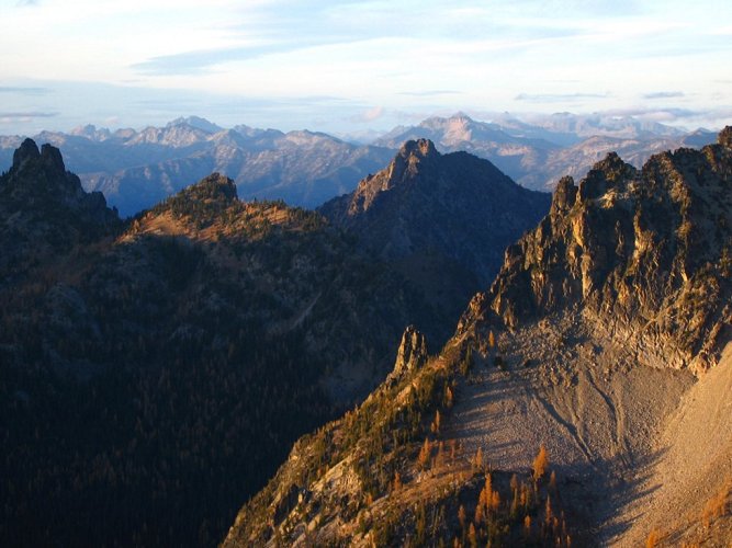 The light was fading fast, spotlighting just a few sections of the peaks stretching southward.